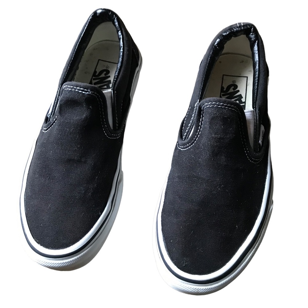 Vans unisex black and white slip on shoes W size 6 M size 4.5 great condition